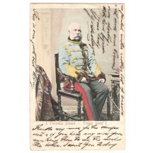 Franz Joseph on brown chair